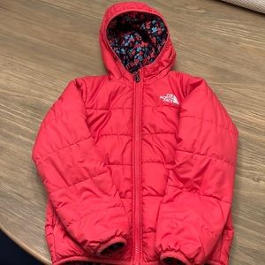 Girls Pink and Floral reversible North Face down coat.